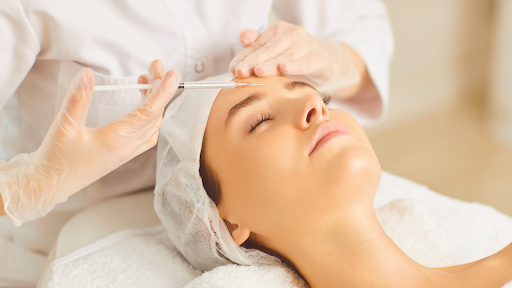 Patient undergoing non-surgical aesthetic care with cosmetic injection.